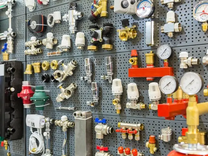 Brass plumbing valves, fittings and guages in a plumbing supply shop